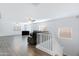 Open living space offers plenty of light, ceiling fans, and wood-look flooring at 43232 W Magnolia Rd, Maricopa, AZ 85138