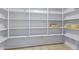 Walk-in pantry with lots of shelving at 43232 W Magnolia Rd, Maricopa, AZ 85138