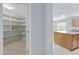 Walk-in pantry with lots of shelving at 43232 W Magnolia Rd, Maricopa, AZ 85138