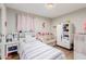 Adorable bedroom featuring a cozy daybed and functional storage solutions at 4716 W Hayward Ave, Glendale, AZ 85301