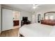 Bright bedroom featuring wood floors, bathroom access, and plentiful storage at 4716 W Hayward Ave, Glendale, AZ 85301