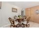 Charming dining area with unique chairs, glass table, and ample cabinet space at 4716 W Hayward Ave, Glendale, AZ 85301