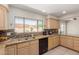 Spacious kitchen featuring granite counters, stainless steel sink, and ample cabinetry at 4716 W Hayward Ave, Glendale, AZ 85301
