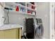 Functional laundry room with ample storage and a modern washer and dryer at 4716 W Hayward Ave, Glendale, AZ 85301