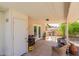Cozy covered patio with wicker furniture, potted plants, and backyard views, perfect for outdoor relaxation at 4716 W Hayward Ave, Glendale, AZ 85301