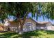 Side view of the house showing the lawn and mature tree with nice shade at 4716 W Hayward Ave, Glendale, AZ 85301