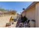 Exterior side yard with a dog house, and miscellaneous outdoor supplies at 4716 W Hayward Ave, Glendale, AZ 85301