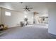 Spacious living area with cozy carpet, natural light, and modern ceiling fan at 5323 E Hopi Ave, Mesa, AZ 85206