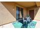 Outdoor patio with seating and a sliding glass door at 5323 E Hopi Ave, Mesa, AZ 85206