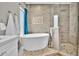 Beautiful bathroom featuring a soaking tub, luxurious shower, and stylish tile work at 5406 E Charleston Ave, Scottsdale, AZ 85254