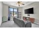 Cozy bedroom with a large window, entertainment center, and comfortable furnishings at 5406 E Charleston Ave, Scottsdale, AZ 85254