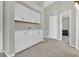 Bonus room featuring neutral carpets, plenty of cabinet space, and modern finishes at 5406 E Charleston Ave, Scottsdale, AZ 85254