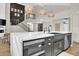 Bright, open kitchen with an island, stainless steel appliances, and pendant lighting at 5406 E Charleston Ave, Scottsdale, AZ 85254