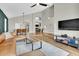 Open-concept living area features high ceilings, wood floors, modern lighting, and a cozy lounge area at 5406 E Charleston Ave, Scottsdale, AZ 85254