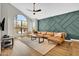 Spacious living room featuring vaulted ceilings, abundant natural light, and modern decor with wood-look floors at 5406 E Charleston Ave, Scottsdale, AZ 85254