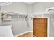 Walk-in closet with clothing racks, shelving, and a wooden dresser at 5406 E Charleston Ave, Scottsdale, AZ 85254