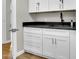 Spacious wet bar area with white cabinets, dark countertops, and sleek hardware at 5406 E Charleston Ave, Scottsdale, AZ 85254