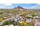 Expansive aerial view of the neighborhood with mature trees and beautiful mountain views at 5528 E Virginia Ave, Phoenix, AZ 85008