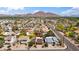 Aerial view of home showcasing the neighborhood, landscape, and mountain views at 5528 E Virginia Ave, Phoenix, AZ 85008