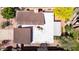 Aerial view of the house showcasing the roof, backyard, patio, and surrounding trees at 5528 E Virginia Ave, Phoenix, AZ 85008