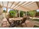 Covered back patio with stone pavers and furniture offers relaxing outdoor living at 5528 E Virginia Ave, Phoenix, AZ 85008