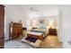 Bright bedroom with high vaulted ceilings and stylish wood furniture at 5528 E Virginia Ave, Phoenix, AZ 85008