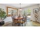 Open dining room with slate floors, a large mirror, and doors to the patio at 5528 E Virginia Ave, Phoenix, AZ 85008