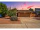 Inviting exterior with a well-maintained yard, desert foliage and spacious two-car garage at 5528 E Virginia Ave, Phoenix, AZ 85008