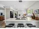 Spacious kitchen with quartz countertops, a breakfast bar and stone tile flooring at 5528 E Virginia Ave, Phoenix, AZ 85008
