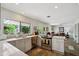 Bright kitchen featuring stone tile flooring, modern stainless steel appliances, and quartz countertops at 5528 E Virginia Ave, Phoenix, AZ 85008