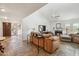 Inviting living room with high ceilings, a stone tile floor, and a cozy fireplace at 5528 E Virginia Ave, Phoenix, AZ 85008