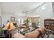 Spacious living room boasts high ceilings, a fireplace, stone floors, and abundant natural light at 5528 E Virginia Ave, Phoenix, AZ 85008