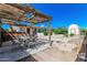 Outdoor patio and landscaped backyard featuring gravel, low-maintenance desert landscaping, and stone pavers at 5625 E Dodge St, Mesa, AZ 85205