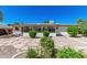 Charming backyard with well-maintained landscaping, rock features, and a screened-in porch, perfect for outdoor enjoyment at 5625 E Dodge St, Mesa, AZ 85205