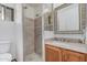 This bathroom features a glass enclosed shower with neutral tile and a vanity sink at 5625 E Dodge St, Mesa, AZ 85205