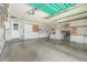 Spacious garage featuring built-in cabinets for ample storage and an automatic garage door at 5625 E Dodge St, Mesa, AZ 85205