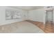 Inviting living room with neutral carpet, tile flooring, a large window, and white walls at 5625 E Dodge St, Mesa, AZ 85205