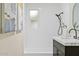 Bathroom features white subway tile, a shower-tub combo and a dark vanity with a light countertop at 5738 N 34Th S Dr, Phoenix, AZ 85017
