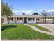 Charming single-story home with a well-manicured lawn and covered carport at 5738 N 34Th S Dr, Phoenix, AZ 85017