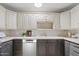 This kitchen has two-tone cabinets, stainless appliances and a tile backsplash at 5738 N 34Th S Dr, Phoenix, AZ 85017