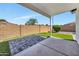 Fenced backyard with hardscape and manicured lawn at 6108 S Wilson Dr, Chandler, AZ 85249