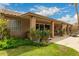 Well-manicured backyard with mature landscaping, covered patio, and inviting outdoor space for relaxation and enjoyment at 6128 E Portia St, Mesa, AZ 85215
