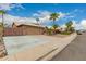 Lovely home with a two-car garage, spacious driveway and low maintenance desert landscaping at 6128 E Portia St, Mesa, AZ 85215