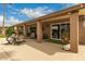 Large, covered patio with an outdoor dining set and seating, perfect for entertaining and enjoying outdoor meals at 6128 E Portia St, Mesa, AZ 85215