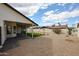 A spacious backyard featuring gravel, a covered patio, and desert landscaping at 6228 E Blanche Dr, Scottsdale, AZ 85254