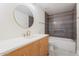 Bathroom featuring vanity with great lighting and shower-tub combo at 6228 E Blanche Dr, Scottsdale, AZ 85254