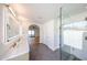 Bright bathroom featuring a glass enclosed shower, modern finishes, and open floorplan at 6228 E Blanche Dr, Scottsdale, AZ 85254