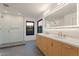 Modern bathroom featuring double sinks, vanity and glass-enclosed shower at 6228 E Blanche Dr, Scottsdale, AZ 85254
