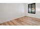 Bedroom with hardwood floors and a window offering natural light at 6228 E Blanche Dr, Scottsdale, AZ 85254