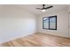 Bedroom with hardwood floors and a window offering natural light at 6228 E Blanche Dr, Scottsdale, AZ 85254